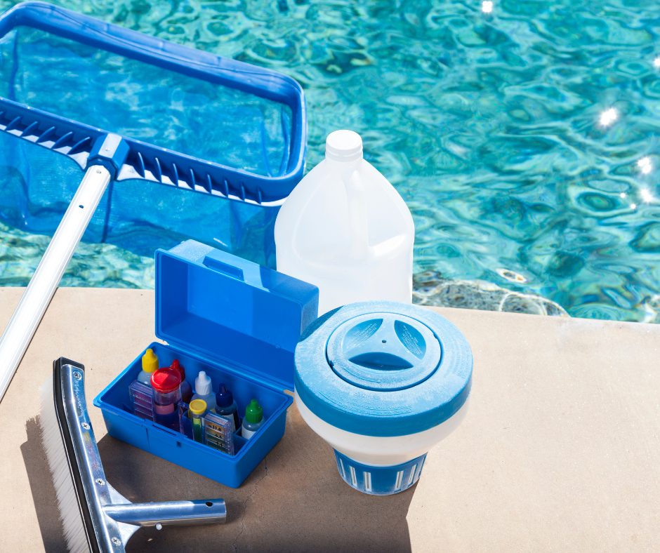 Pool cleaning tools beside a sparkling blue pool. Includes a net, test kit, chlorine floater, and jug, suggesting maintenance and care.